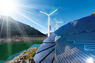 Low angle view of wind turbine against sky