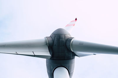 Low angle view of airplane flying against clear sky