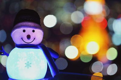 Close-up of colorful lights on railing