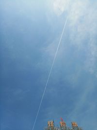 Low angle view of vapor trails against sky