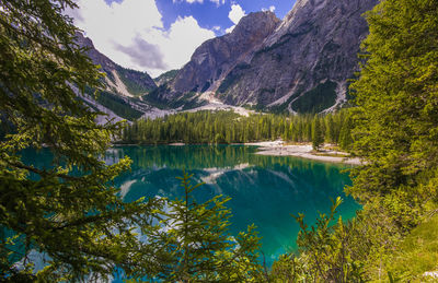 Scenic view of lake and mountains against sky