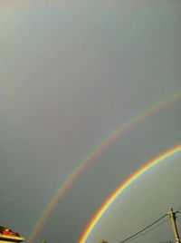 Low angle view of rainbow against sky