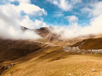 View of mountain range against cloudy sky