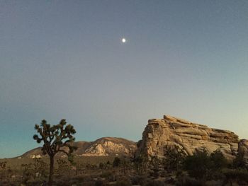 Scenic shot of rocky mountain range against clear sky