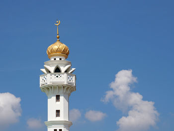 Low angle view of clock tower against sky