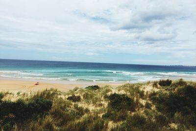 Scenic view of sea and cloudy sky