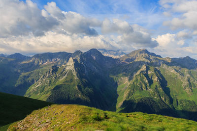 Panoramic of green mountains with blue sky and white clouds