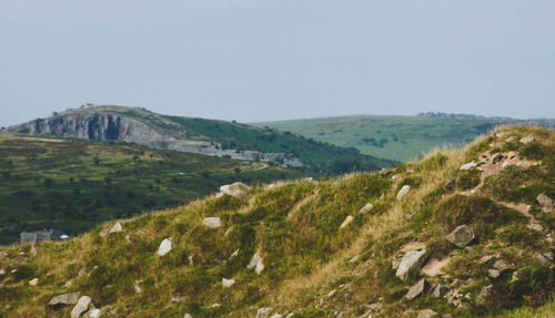 View of countryside landscape against clear blue sky