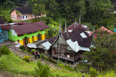 High angle view of houses and trees in forest