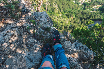 Low section of person on rock