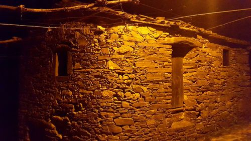 Low angle view of illuminated building at night