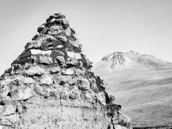 Low angle view of rock formation against clear sky