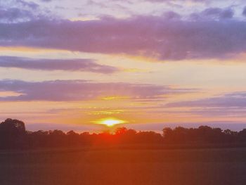 Scenic view of sunset over landscape