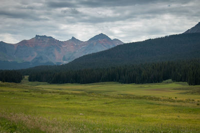 Scenic view of landscape and mountains against sky