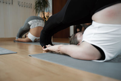 Group of women practicing pilates exercises in class