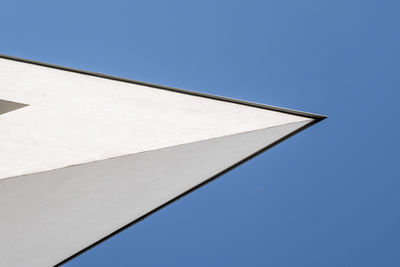 Low angle view of building against clear blue sky