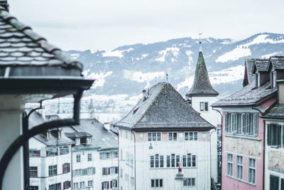 Buildings against sky during winter