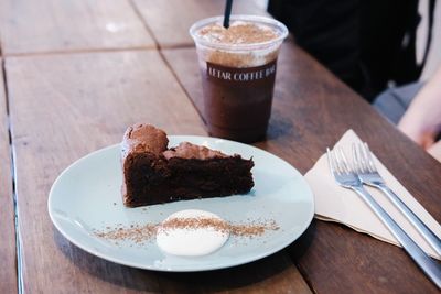 Close-up of cake with coffee served on table