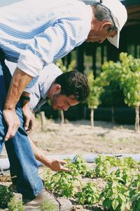 Midsection of man with plants