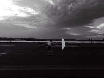 View of road against cloudy sky