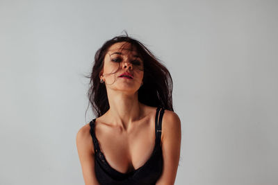 Portrait of a beautiful young woman over white background