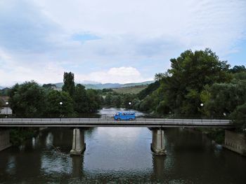 Car on bridge over river