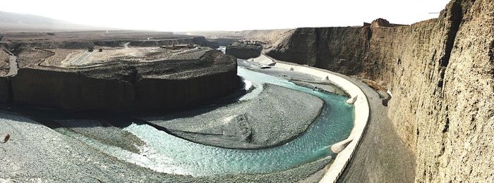 High angle view of dam on mountain against sky