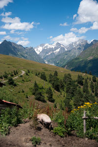 Scenic view of mountains against cloudy sky