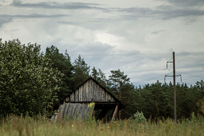 Built structure on field against sky