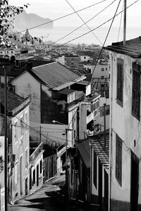 Houses in city against sky during winter