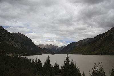 Scenic view of lake and mountains against sky