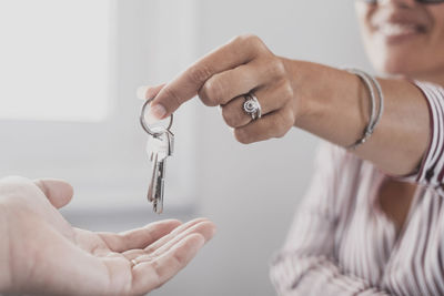 Midsection of man holding key