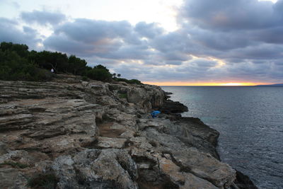 Scenic view of sea against cloudy sky
