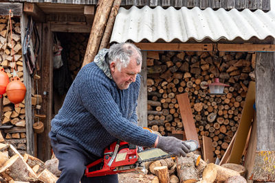 Side view of man working in workshop