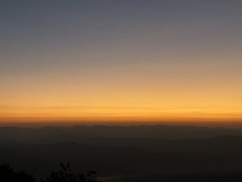 Scenic view of silhouette landscape against sky during sunset