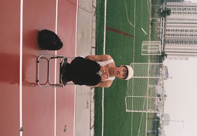 Rear view of man outside building