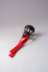 High angle view of red flag on white background