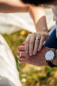 Close-up of couple holding hands