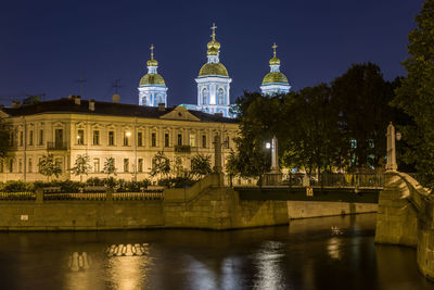 Illuminated buildings at waterfront