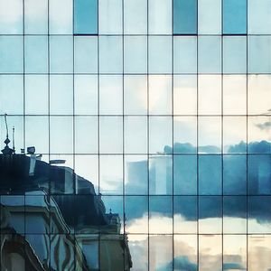 Low angle view of office building against sky