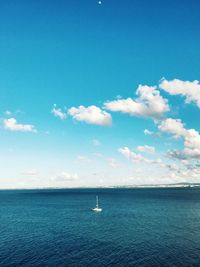 Sailboat sailing in sea against sky