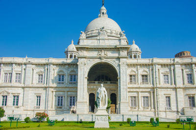 Facade of historical building against clear blue sky