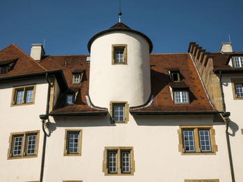 Low angle view of residential buildings against clear sky