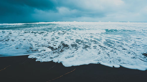 Scenic view of sea against sky during winter