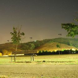 Scenic view of field against sky at night