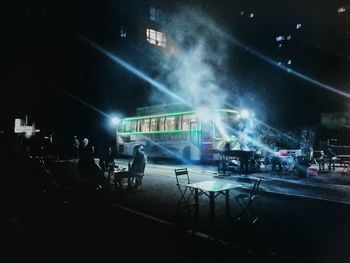 People on city street at night