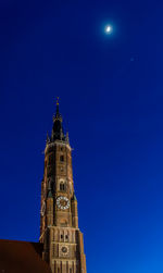 Low angle view of church against blue sky