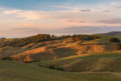 Scenic view of landscape against sky during sunset