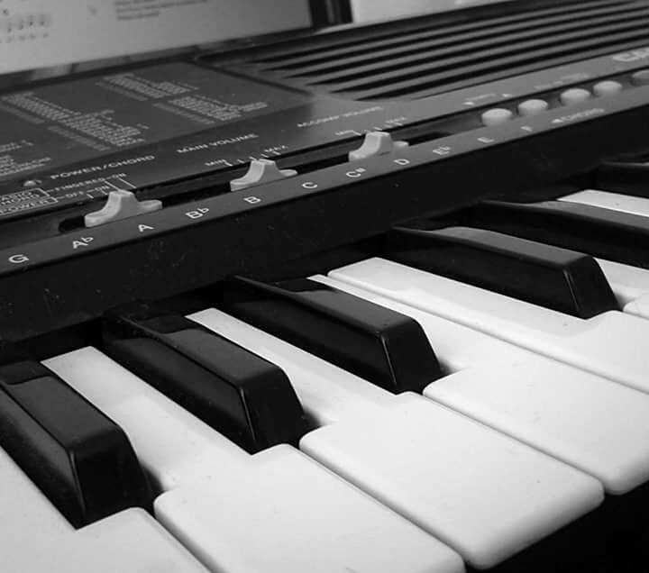 CLOSE-UP OF PIANO KEYS IN OFFICE