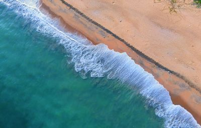 High angle view of ice on sea shore